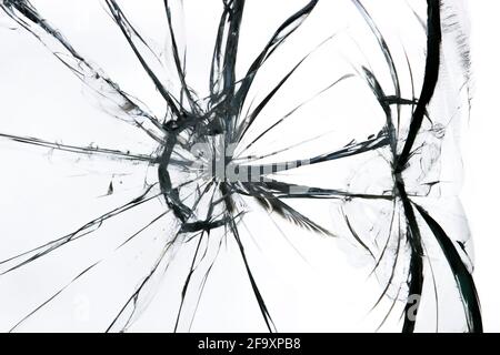 Cracked broken glass texture. Cracked window on a white background Stock Photo