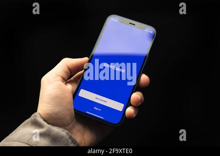 Kharkov, Ukraine - April 20, 2021: Coinbase cryptocurrency app titlce screen on Apple iPhone screen close up Stock Photo