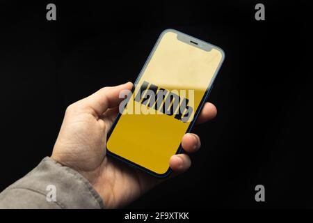 Kharkov, Ukraine - April 20, 2021: iMDB application logo on Apple iPhone screen, black background photo Stock Photo