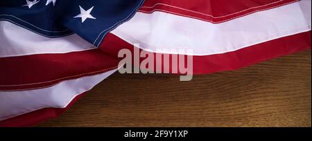 American flag on old wooden board. Celebration frame with free space for text. Stock Photo