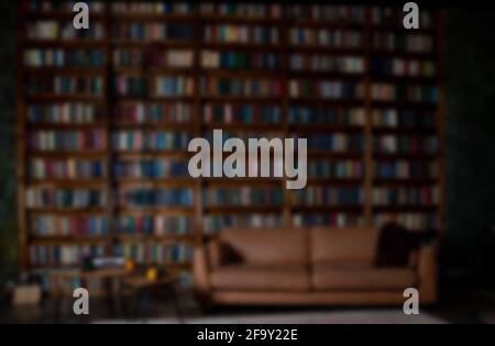 Book background. Selective focus. Blurred texture of old books. Bookshelves in the library Stock Photo