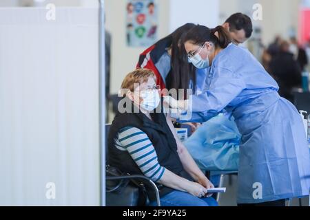 Zagreb, Croatia. 21th April 2021. Organized mass vaccination of citizens with the Pfizer vaccine  against Covid 19 virus in pavilion 6 of the Zagreb Fair. Medical workers vaccinate citizens. Stock Photo