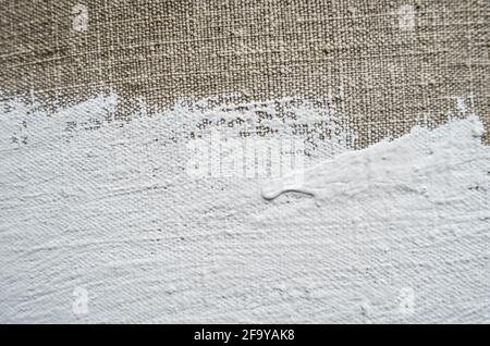 Texture of homewoven canvas and white paint. Design with place for your text. Stock Photo