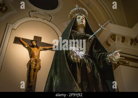 Easter holidays.Before the procession, the statue of the Madonna,pierced by pain, cry in front of the statue of Christ on the cross. Sulmona, Abruzzo Stock Photo