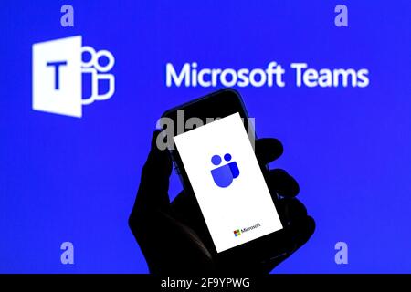 Spain. 20th Apr, 2021. In this photo illustration a Microsoft Teams app seen displayed on a smartphone with the Microsoft Teams logo in the background. (Photo by Thiago Prudencio/SOPA Images/Sipa USA) Credit: Sipa USA/17�Թ����� Live News Stock Photo