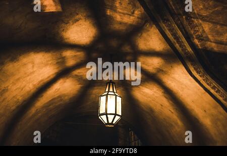 light from the lamp on the ceiling and the shadows in the mysterious arch Stock Photo