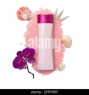 Pink bottle mockup on sea salt with seashells, molluscs and orchid on white isolated background. Copy space Stock Photo