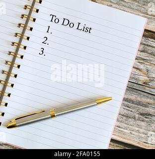 Top view of a pen with To Do List written on a notebook. Stock Photo