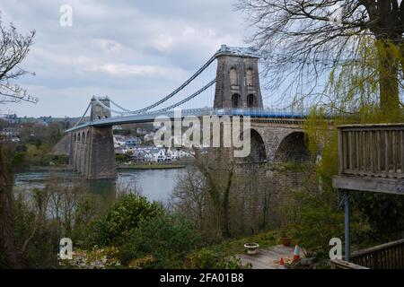 The Menai Suspension Bridge looking over from the west on the Bangor side. Stock Photo