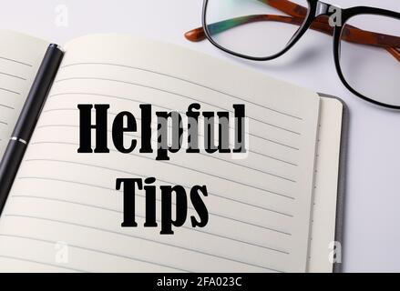 Helpful tips written on a notebook. Stock Photo