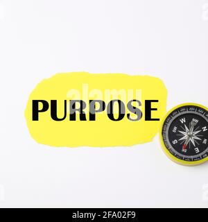 Purpose words written on a yellow torn paper. Stock Photo