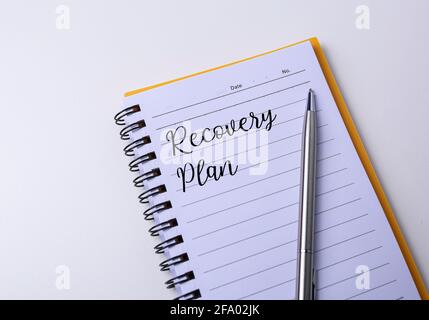 Recovery plan written on a notebook. Stock Photo