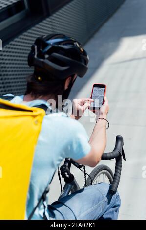 man on bike with smartphone map app Stock Photo