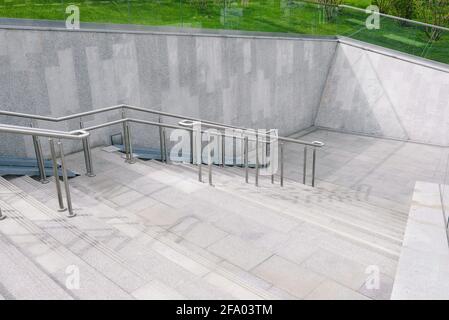 Gray staircase with a ramp for the disabled. Urban architecture. Exit ...