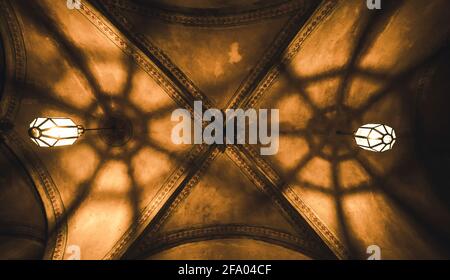 light from the lamp and the shadows in the mysterious arch Stock Photo