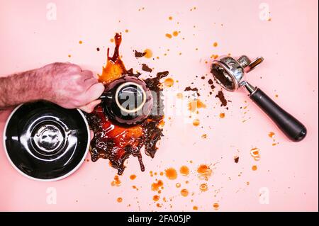 coffee overturned on pink background Stock Photo
