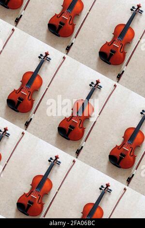 Violin pattern on grey background. Minimalistic concept music instrument Stock Photo