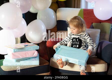 @ young sisters having a lockdown birthday at home. UK Stock Photo