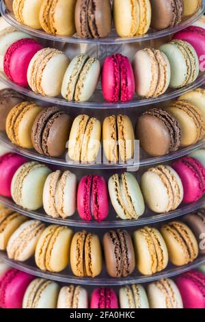 A tower of macaroons in different flavours, sweet treats in a bakery Stock Photo