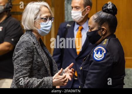 Washington, United States. 21st Apr, 2021. Acting Chief of the Capitol Police Yogananda Pittman (R) chats with Senate Sergeant at Arms Karen Gibson (L) after they testified before a Senate Appropriations Subcommittee hearing on proposed budget estimates for fiscal year 2022 in the Dirksen Senate Office Building in Washington, DC, USA, 21 April 2021. Pool photo by Jim Lo Scalzo/UPI Credit: UPI/Alamy Live News Stock Photo