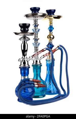 Three oriental hookahs isolated on a white background. Hookahs with blue glass vases. Stock Photo