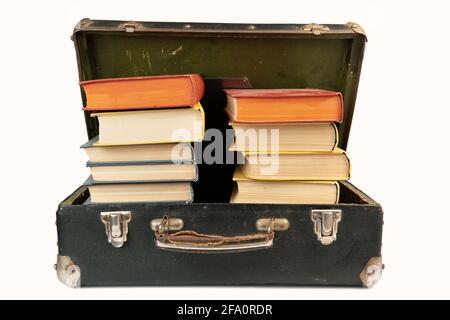 Vintage suitcase full of old books isolated on white Stock Photo