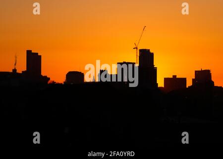 Sunrise behind Leeds City Centre skyline.Yorkshire's tallest building 'Altus House' is currently under construction Stock Photo