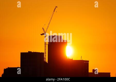 Sunrise behind Leeds City Centre skyline.Yorkshire's tallest building 'Altus House' is currently under construction Stock Photo