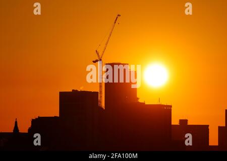 Sunrise behind Leeds City Centre skyline.Yorkshire's tallest building 'Altus House' is currently under construction Stock Photo