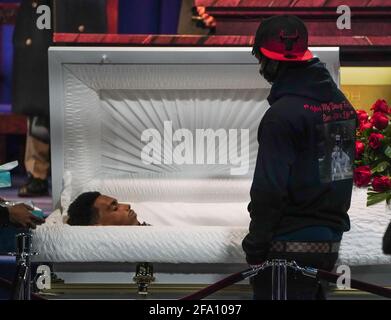 Minneapolis, United States. 21st Apr, 2021. AJ Wright stands next to his brother's coffin during a public viewing for 20-year-old Daunte Wright in Brooklyn Center, Minnesota on Wednesday, April 21, 2021. Wright was shot and killed by police officer Kimberly Ann Potter, who thought she was using a taser gun, during a recent traffic stop and attempted arrest. Photo by Jemal Countess/UPI Credit: UPI/Alamy Live News Stock Photo