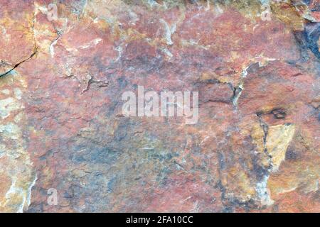 Abstract Background of a carbonate rock, Old red volcanic color limestone surface stone material Stock Photo