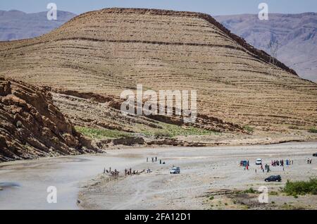 Hammat Moulay Ali Cherif, Morocco - April 11, 2015. People bathing in river Ziz Stock Photo