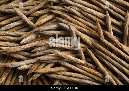 Pile of dirty and rusted used galvanized steel nails Stock Photo