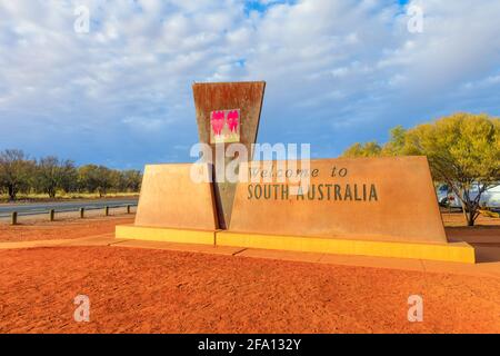 South Australia, Australia - Aug 27, 2019: border sign between Australian states, Northern Territory and South Australia on A87 Stuart highway. South Stock Photo