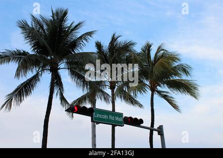Lincoln Road Mall street sign located in Miami Beach with palm trees in the background. Stock Photo