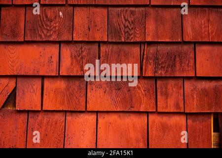 Brilliant Red Stained Shakes Line Cabin Wall Stock Photo