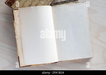 Old vintage book on wooden table. Open book with blank pages Stock Photo