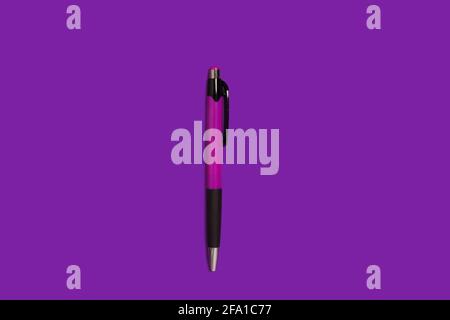 automatic pen lying on a purple background Stock Photo