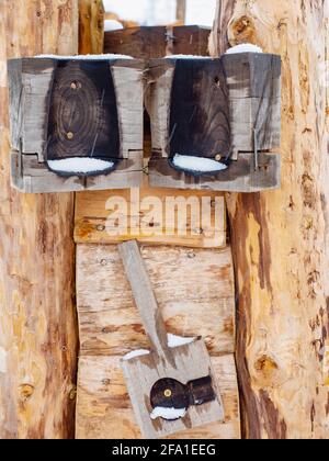 Worn out and burnt wooden glass molds. Stack of used wooden glass shaping tools and moulds to be used when blowing glass. Glass design studio Kunratic Stock Photo