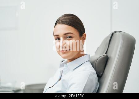 Pleased beauty salon customer posing for the camera Stock Photo