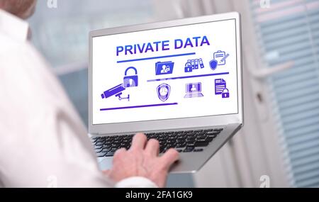 Private data concept shown on a laptop used by a man Stock Photo