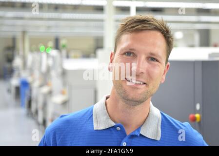 portrait of a worker in the engineering department of a factory for the production and construction of electronics Stock Photo