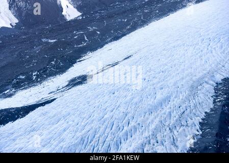 Beijing, China. 13th July, 2020. Photo taken on July 13, 2020 shows the Tasman Glacier at Aoraki/Mount Cook National Park in the South Island of New Zealand. The Aoraki/Mount Cook National Park consists of 19 peaks which are at least 3,000 meters above sea level, as well as the Tasman Glacier and many glacial lakes. Our homeland, the Earth, is faced with grave challenges to its climate and environment. It is our bounden duty to take action and protect the Blue Plannet where every one of us lives. Credit: Guo Lei/Xinhua/Alamy Live News Stock Photo