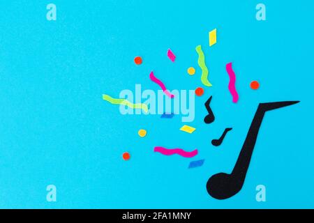 Festival and holiday. A cutted out of felt big note on a blue background. Flat lay. International Jazz Day. Copy space. Stock Photo