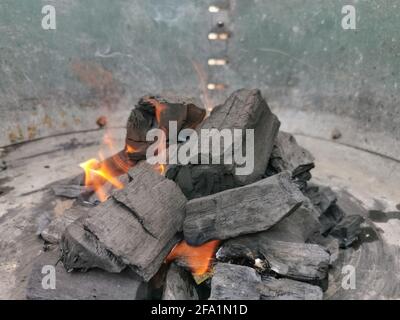 Macro view of burning coal embers bonfire, detail of coal texture... Stock Photo