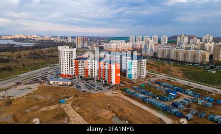 Flight over the construction site. City new building. Construction of panel multi-storey buildings. Stock Photo