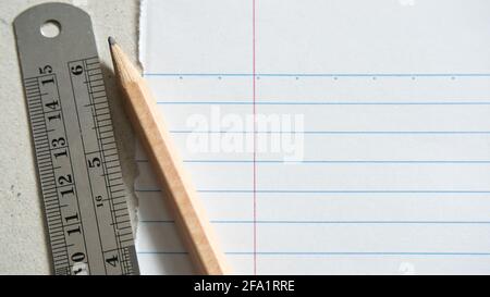 lined paper, pencil and ruler Stock Photo
