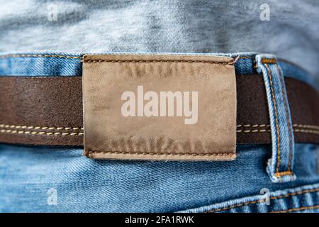 Leather label on the back of blue jeans Stock Photo