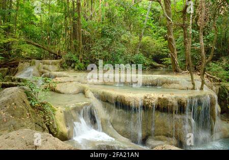 The falls are striking clear emerald green waters located in Erawan National Park. Formed by 7 levels with natural pools Stock Photo