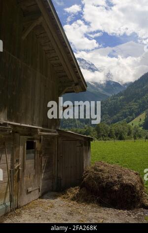 Old wooden barn on the floor of the spectacular upper Lauterbrunnen valley near Stechelberg, Bernese Oberland, Switzerland Stock Photo